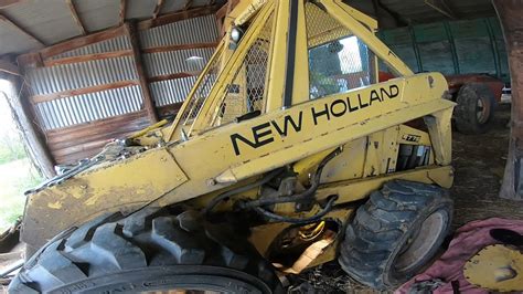 new holland skid steer hydraulic drain